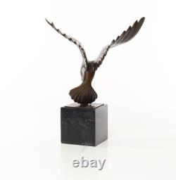 Sculpture of a Flying Pigeon on a Black Marble Base after Ceonard