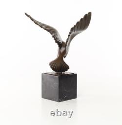Sculpture of a Flying Pigeon on a Black Marble Base after Ceonard