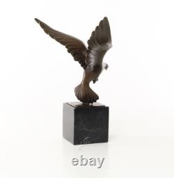 Sculpture of a Flying Pigeon on a Black Marble Base after Ceonard
