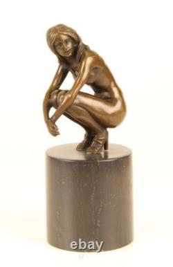 Sculpture of a Nude Woman Sitting in Bronze on a Black Marble Base after Claude