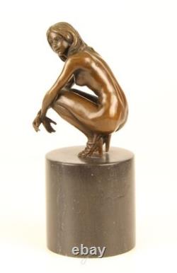 Sculpture of a Nude Woman Sitting in Bronze on a Black Marble Base after Claude