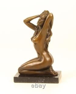 Sculpture of a Nude Woman Sitting in Bronze on a Black Marble Base after Claude
