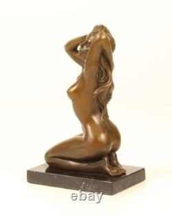 Sculpture of a Nude Woman Sitting in Bronze on a Black Marble Base after Claude