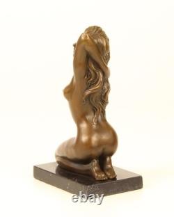 Sculpture of a Nude Woman Sitting in Bronze on a Black Marble Base after Claude