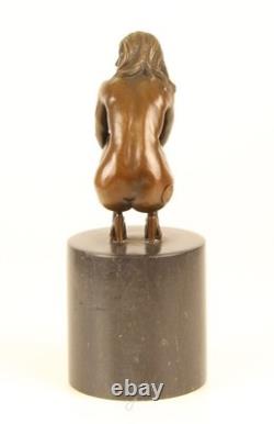 Sculpture of a Nude Woman Sitting in Bronze on a Black Marble Base after Claude
