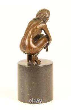 Sculpture of a Nude Woman Sitting in Bronze on a Black Marble Base after Claude