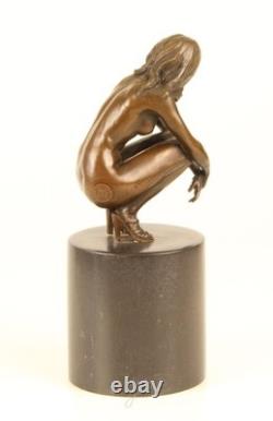 Sculpture of a Nude Woman Sitting in Bronze on a Black Marble Base after Claude