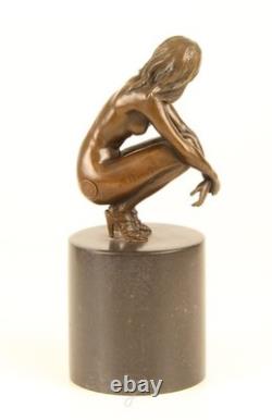 Sculpture of a Nude Woman Sitting in Bronze on a Black Marble Base after Claude