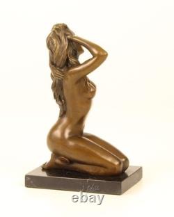 Sculpture of a Nude Woman Sitting in Bronze on a Black Marble Base after Claude