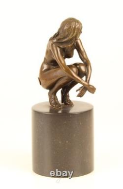 Sculpture of a Nude Woman Sitting in Bronze on a Black Marble Base after Claude