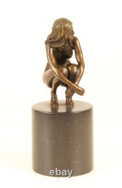 Sculpture of a Nude Woman Sitting in Bronze on a Black Marble Base after Claude