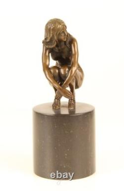Sculpture of a Nude Woman Sitting in Bronze on a Black Marble Base after Claude
