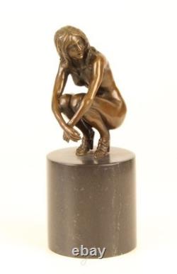 Sculpture of a Nude Woman Sitting in Bronze on a Black Marble Base after Claude