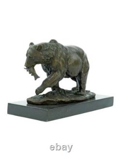 Sculpture of a bear with fish in bronze on a black marble base after Milo