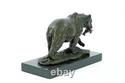 Sculpture of a bear with fish in bronze on a black marble base after Milo