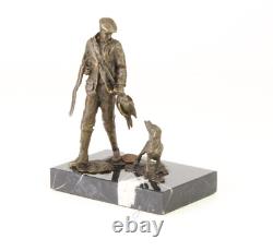 Sculpture of a hunter with a dog on black marble signed Sculpture of a hunter with a dog on black marble signed