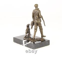 Sculpture of a hunter with a dog on black marble signed Sculpture of a hunter with a dog on black marble signed