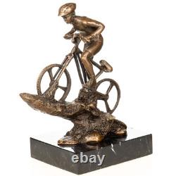 Sculpture of a mountain biker in bronze on black marble after Nick
