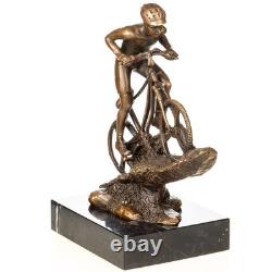 Sculpture of a mountain biker in bronze on black marble after Nick