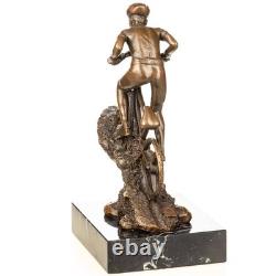 Sculpture of a mountain biker in bronze on black marble after Nick