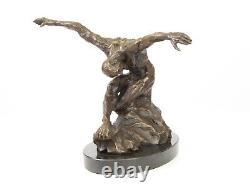 Sculpture of a nude modern dancer in bronze on black marble after Milo