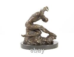 Sculpture of a nude modern dancer in bronze on black marble after Milo