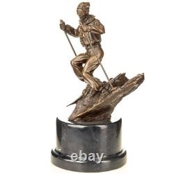 Sculpture of a skier in bronze on a black marble base after Nick