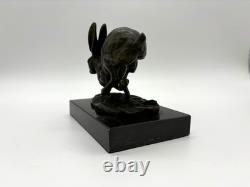 Sculpture of running hares in bronze on a black marble base after Nick