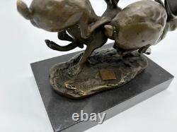 Sculpture of running hares in bronze on a black marble base after Nick