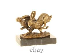 Sculpture of running hares in bronze on black marble after Nick