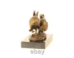 Sculpture of running hares in bronze on black marble after Nick