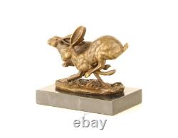 Sculpture of running hares in bronze on black marble after Nick