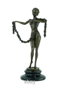 Sculpture of the Dancer of Garland in bronze on a black marble base Signed
