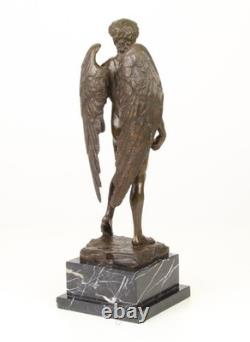 Sculpture of the Winged David in bronze on a marble pedestal after Michelangelo