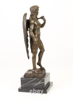Sculpture of the Winged David in bronze on a marble pedestal after Michelangelo