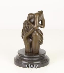 Sculpture of two women in bronze on a black marble base after Nick