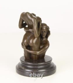 Sculpture of two women in bronze on a black marble base after Nick