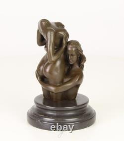 Sculpture of two women in bronze on a black marble base after Nick
