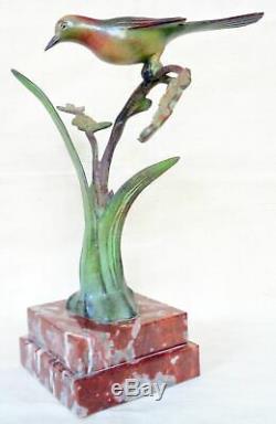 Bronze animalier Art Déco J. BRAULT. Un oiseau sur une branche fleurie