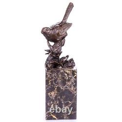 Figurine d'oiseau en bronze sur un marbre