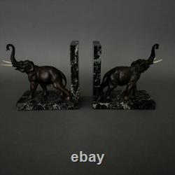 Paire de serre-livres éléphants en bronze signés Carvin bases en marbre M3300
