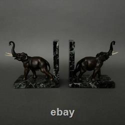 Paire de serre-livres éléphants en bronze signés Carvin bases en marbre M3300