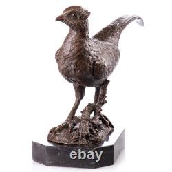 Sculptuire Faisant en bronze sur un socle en un marbre noir Signée