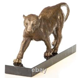 Sculpture Léopard en bronze surun socle en marbre noir d'après François Cartier