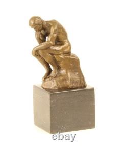 Sculpture en bronze Le Penseur sur un marbre noir d'après Auguste Rodin