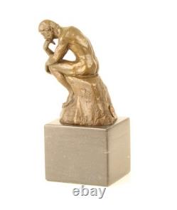 Sculpture en bronze Le Penseur sur un marbre noir d'après Auguste Rodin