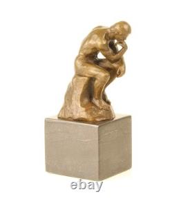 Sculpture en bronze Le Penseur sur un marbre noir d'après Auguste Rodin