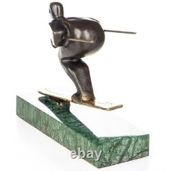 Sculpture en bronze moderne skieur sur un socle en marbre verte d'après Nick