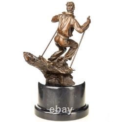 Scupture d'un skieur en bronze sur un socle en marbre noir d'après Nick