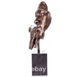 Statue visage avec une main en bronze sur un socle en marbre noir d'après S. Dali